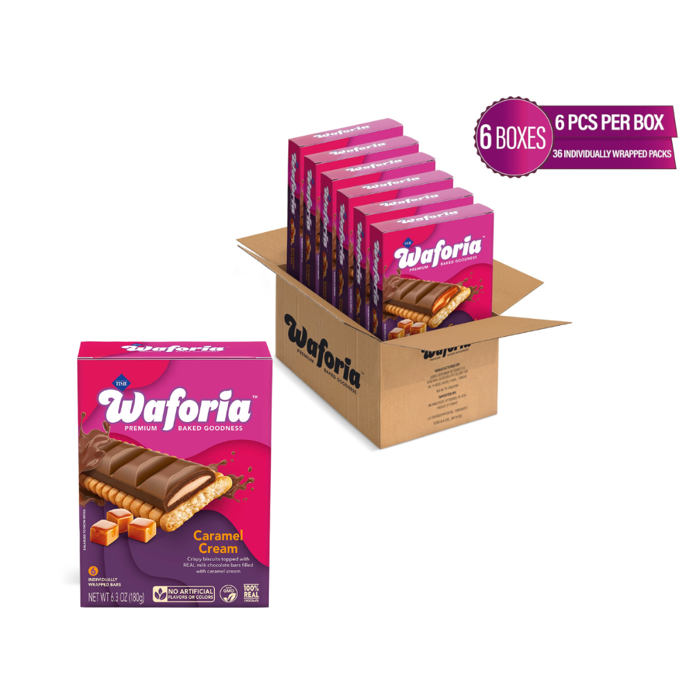 Six boxes of Waforia Premium Caramel Cream Sandwich Wafer bars arranged in a large cardboard shipping box, with one individual box shown in front on a plain white background. A purple badge in the top right reads '6 BOXES 6 PCS PER BOX'.